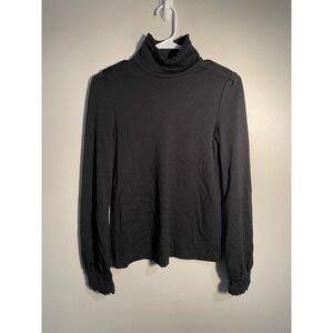 Diane von Furstenberg Black Wool Turtleneck Ruffle Hem Top Size 10 Quiet Luxury‎